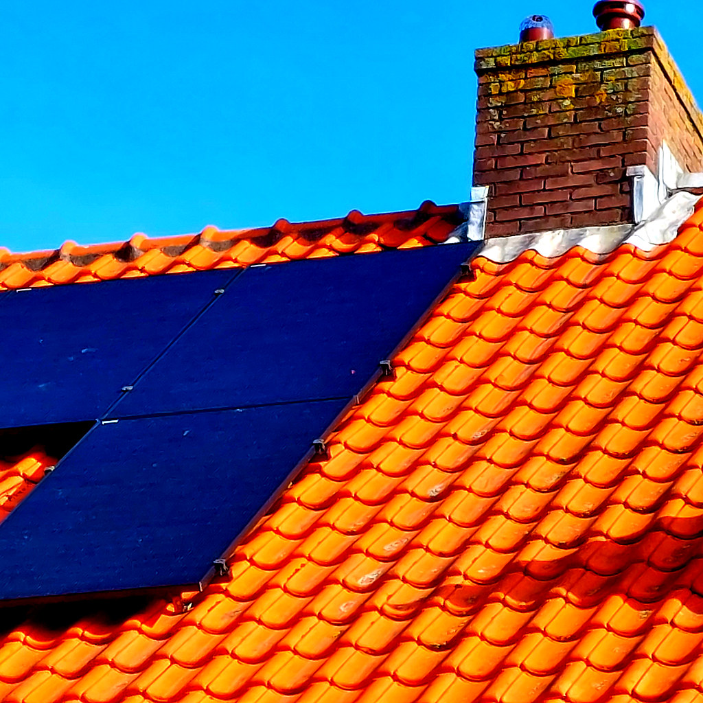 Orange roof with black solar panels