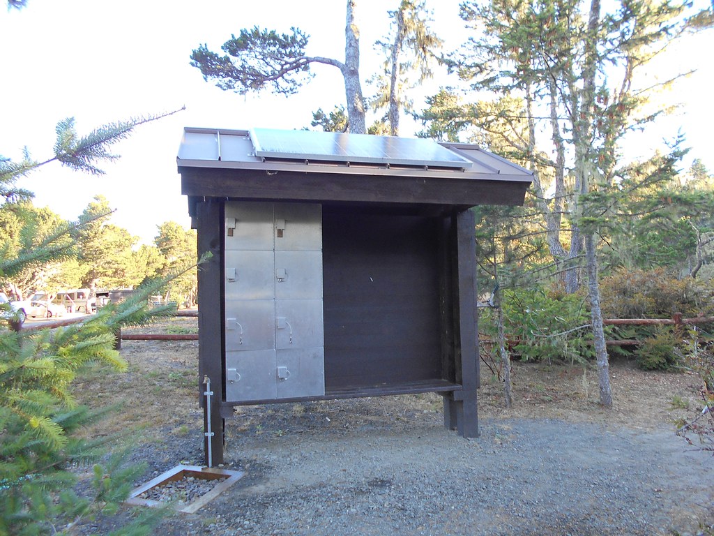 Storage and charging station for various computer devices at bike site, Bandon State Park. Solar panels provide part of the power.